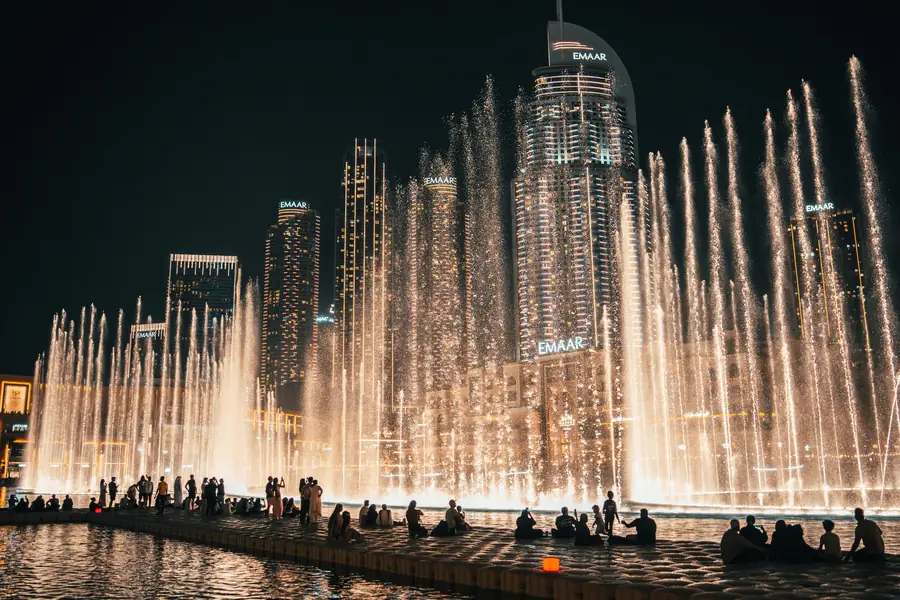 The Dubai Fountain in full jet beneath the Downtown skyline at night