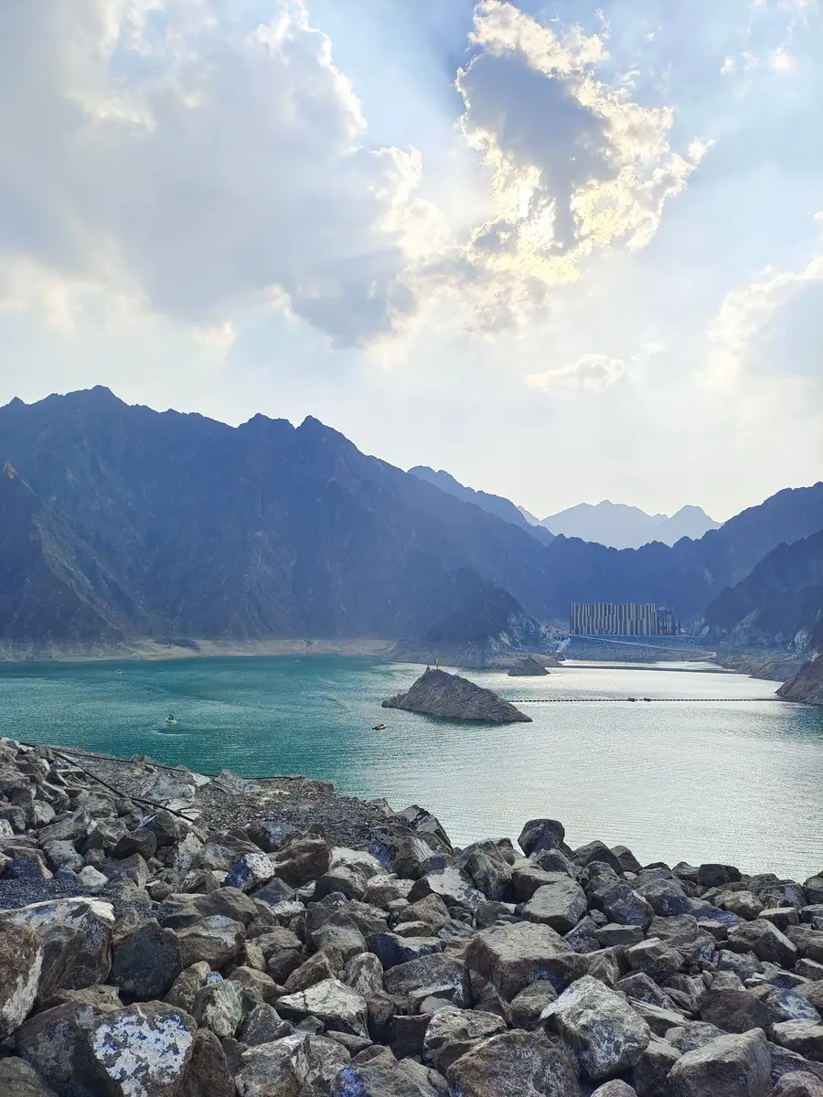 Turquoise water of the Hatta Dam between the Hajar mountains