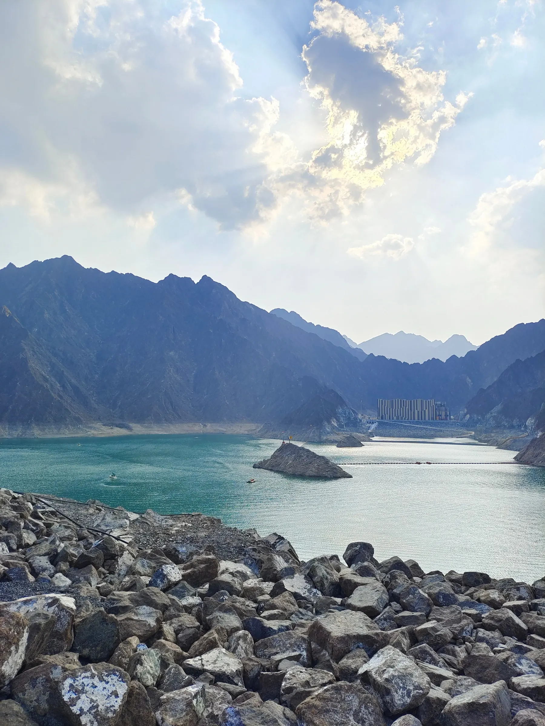 Turquoise water of the Hatta Dam between the Hajar mountains