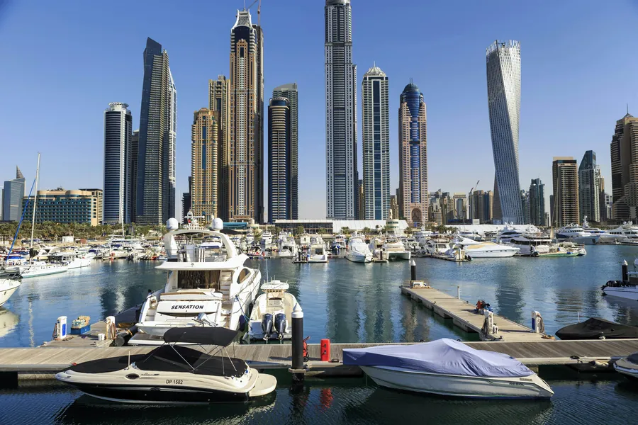 Yachts moored in Dubai Marina below the towers