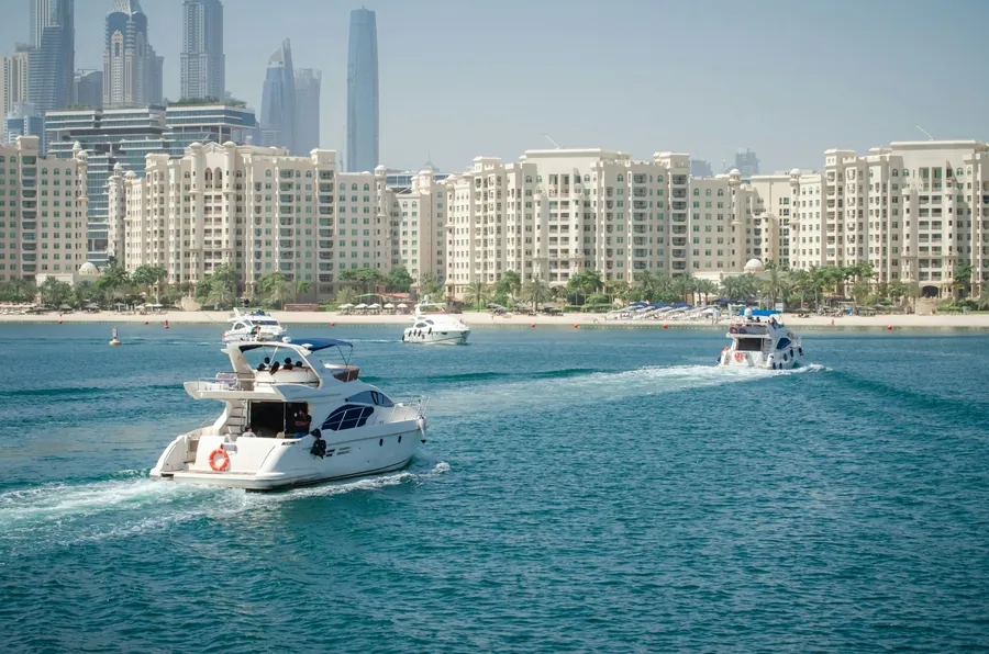 A motor yacht cruising off Palm Jumeirah
