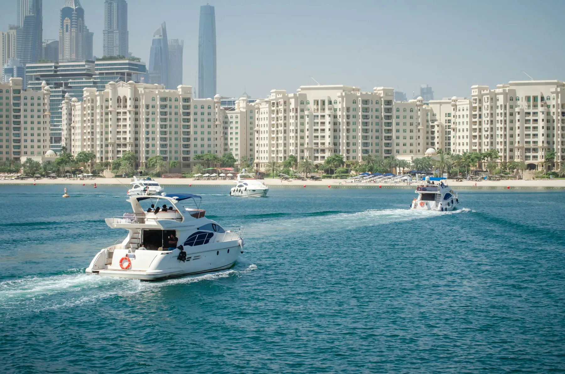A motor yacht cruising off Palm Jumeirah